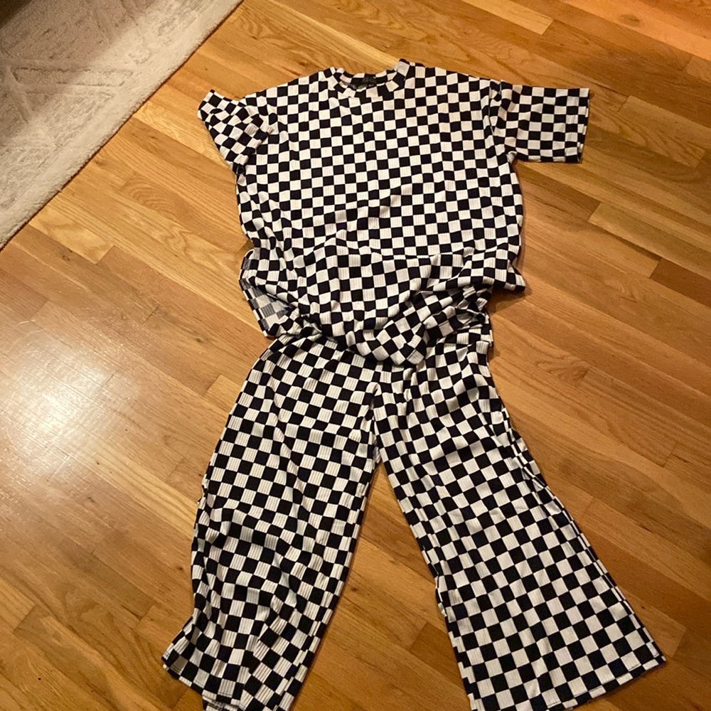 Dressed in Lala checkered play suit, size large